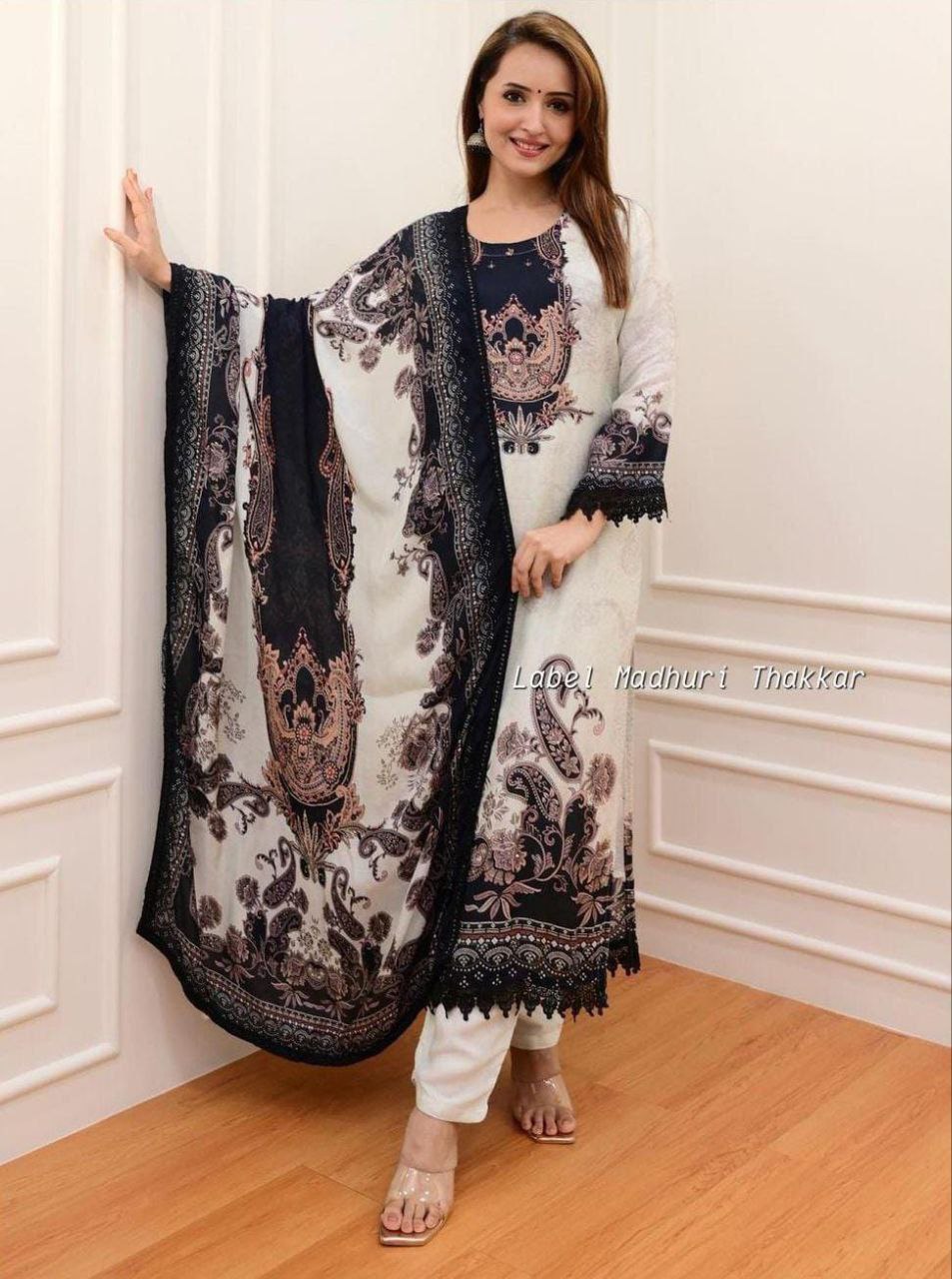 Ivory and Black Pakistani Suits made from Pure Muslin fabric with digital prints and lace detailing certainly sound like a fashionable choice for upcoming occasions. The comfort and style they offer can make them a great addition to your wardrobe.7128